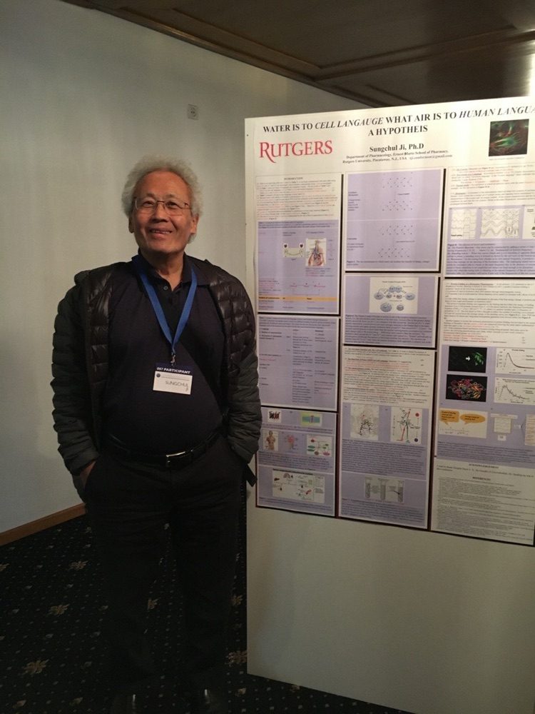 Dr. Sungchul Ji beside a conference poster